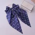 Elegant navy blue hair clip with large polka dot bow and long silk-like streamers - Navy Blue Polka Dot
