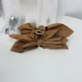 Large brown fabric bow hair claw clip for women, elegant oversized shark clip accessory - Bronze