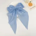 Detailed view of the elegant light blue chiffon bow hair clip with long streamers - Sky Blue