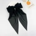 Elegant large black chiffon bow hair clip with long streamers detail view - Black