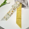 Detail of yellow tulip floral print silk ribbon scarf with "I hope" text description. - Yellow Flower Ribbon