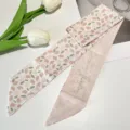 Close-up detail of retro French floral silk hair ribbon featuring Positive Thinking text - Pink Tulip Ribbon