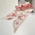 Macro detail view of vintage French style red silk twilly with elegant floral print - Red Sketch Ribbon