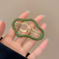 Stylish irregular hollow cloud-shaped hair clip in vintage green and gold finish for women - Green