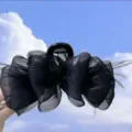 Large black hair claw clip featuring elegant ruffled mesh and light feather accents - Black Mesh Feather Style