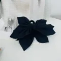Oversized black fabric bow hair tie with an elegant multi-layered design for women - Black