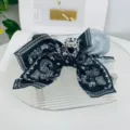 Large hair claw clip with bow design and black white paisley bandana pattern fashion - Black Paisley