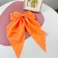 Vibrant large orange chiffon bow hair clip with long streamers and spring clip for women - Orange