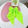 Elegant neon green large chiffon bow hair clip featuring long streamers and spring fastener - Apple Green