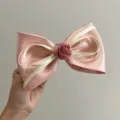 Detailed view of pink satin hair bow featuring a delicate fabric rose centerpiece - Spring Clips / Pink with Rose and Bowknot Spring Clip