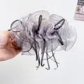 Detailed close-up of a lavender silk gauze bow hair claw clip with black ribbon accents. - Light Purple Striped Gauze Bow Hair Claw / Light Purple