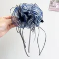 Close-up of elegant blue striped organza hair flower clip with long black ribbons - Mesh Striped Ribbon Style / Blue (Banana Clip)