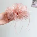 Close-up detail of an elegant pink organza banana hair clip with long flowing ribbons. - Mesh Striped Ribbon Style / Pink (Banana Clip)