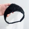 Close-up of a vintage black sequined crown headband with intricate lace detail - Black Linear Embroidered Style