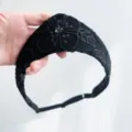 Detailed view of black sequined headband with vintage floral embroidery and mesh texture - Black Embroidered Mesh Style