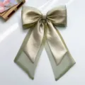 Detailed view of the iridescent organza bow hair clip featuring elegant flowing ribbons - Bow Spring Clip / Green