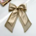 Elegant champagne organza and satin bow hair clip detail with long flowing streamers - Bow Spring Clip / Gold
