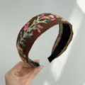 Close-up of bohemian embroidered wide headband with vintage floral patterns. - Wide Headband / Brown Floral