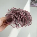 Close-up view of an elegant dark mauve mesh ruffled hair claw clip with pink piping details. - Mesh Pleated Claw Clip / Purple