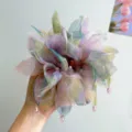 Detail view of colorful oversized floral scrunchie with sheer organza fabric and beaded edges - Wisteria + Mesh Bud Hair Tie