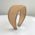 Close-up detail showing the natural texture of a beige woven straw wide headband accessory - Khaki