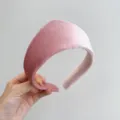 Detailed macro view of soft pink velvet texture on padded vintage style headband - Pink