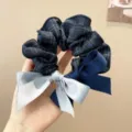 Detailed close-up of a stylish plaid scrunchie featuring a two-tone ribbon bow. - L / Navy Blue Plaid Bow Hair Tie