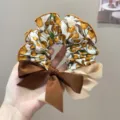 Detailed view of the Korean style hair scrunchie featuring orange fruit prints and bows - L / Fruit Print Bow Hair Tie