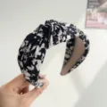 Close-up detail of black and white floral knotted headband with wide fabric band - Ink Floral Knot Style / Black