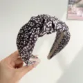 Close-up detail of a wide-edge headband with black and white ink-wash floral pattern - Leopard Knotted Style / Light Purple
