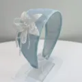 Detailed view of light blue wide headband with exquisite handmade beaded flower embellishment. - Blue (S729)