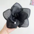 Macro detail of a large black mesh rose hair accessory showing intricate fabric layers - Black Hair Tie / 1 Piece / Black