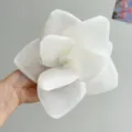 Macro detail of a large white mesh fabric rose hair clip with elegant layered petals. - Creamy White