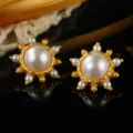 Macro detail of vintage-style gold earrings with central pearl and decorative accents - Solar Radial Geometric Large Artificial Pearl Style (E4-19821A-6200)