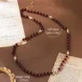 Detailed macro view showing dimensions of vintage natural stone and pearl necklace. - 18K Gold / Dark Red Stone White Pearl Long (N6-13682-18000)
