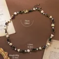 Close-up detail of vintage contrast natural stone and pearl necklace with 74cm length - 18K Gold / Black White Geometric Stone Pearl (N6-13680B-34600)