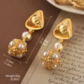 Close-up detail of vintage-style pearl drop earrings showing size and weight specs - Pearl Hollow Ball Long Dangle Style (E4-18901B-8500)