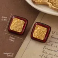 Close-up of vintage square earrings with dark red enamel and gold swirl pattern - Square Red and Gold Enamel Oil Painting Style (E4-19622C-5500)