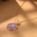 Detailed close-up of a vintage court style floral necklace with a purple pendant and gold chain - Purple Zodiac Flower Necklace (2-27218-N-6500)