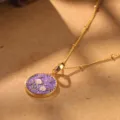 Detail view of a retro floral pendant necklace with purple enamel on a golden chain. - Purple and Pink Floral Necklace (2-27222-N-6500)