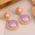 Vintage palatial style earrings featuring pink rose relief on purple textured round disks - Pink Rose on Purple Background Earrings (2-27144A-8200)
