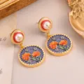 Vintage palace style round earrings with birth flower design and gold foil pearl. - Orange-Red Floral Vintage Earrings (2-27221-8200)