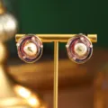 Detail view of artistic enamel oil painting earrings with natural baroque pearls on a stand - Tri-Color Enamel Painted Pearl Gold Foil Style (E4-21832B-6500) / 1 Pair