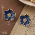 Elegant vintage gold-plated blue enamel flower stud earrings with a crystal center detail - Deep Blue Enamel Flower Style (2-22175-5500)
