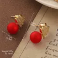 Vintage gold-toned triangle earrings featuring matte red pearls and rhinestone details - Triangular Ornament with Red Bead Style (2-25914-4500)