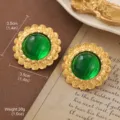 Vintage-style gold-tone earrings with green domed centers and floral details. - Vintage Spiral Flower Style (E4-21574-5500)