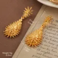 Vintage gold star and floral teardrop earrings with textured spikes for retro style - Octagonal Star Teardrop Cluster Style (E4-21580A-5500)