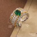 Ornate vintage style ring with large green emerald-cut stone and white accents. - Vintage Green Gemstone Ring (1-3303-6500)