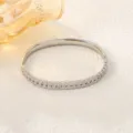 Detailed macro view of a silver stainless steel bangle featuring a delicate wheat ear design. - Wheat Ear Open Style (sz252) / Steel
