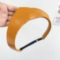 Detailed view of the yellow leather crown headband with adjustable elastic strap - Adjustable Size / Yellow